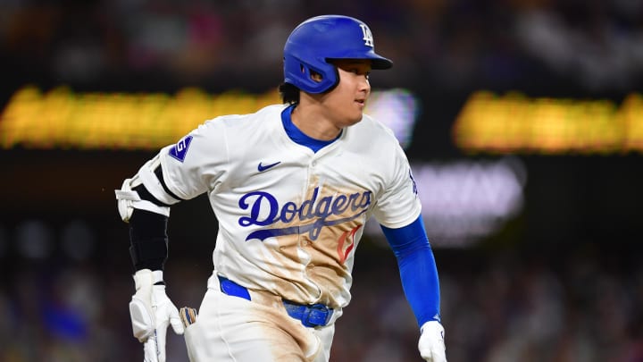 Aug 19, 2024; Los Angeles, California, USA; Los Angeles Dodgers designated hitter Shohei Ohtani (17) runs out a ground ball against the Seattle Mariners during the sixth inning at Dodger Stadium. Mandatory Credit: Gary A. Vasquez-USA TODAY Sports