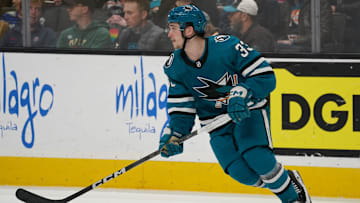 Apr 13, 2024; San Jose, California, USA; San Jose Sharks defenseman Calen Addison (33) controls the puck against the Minnesota Wild during the third period at SAP Center at San Jose. Mandatory Credit: David Gonzales-USA TODAY Sports