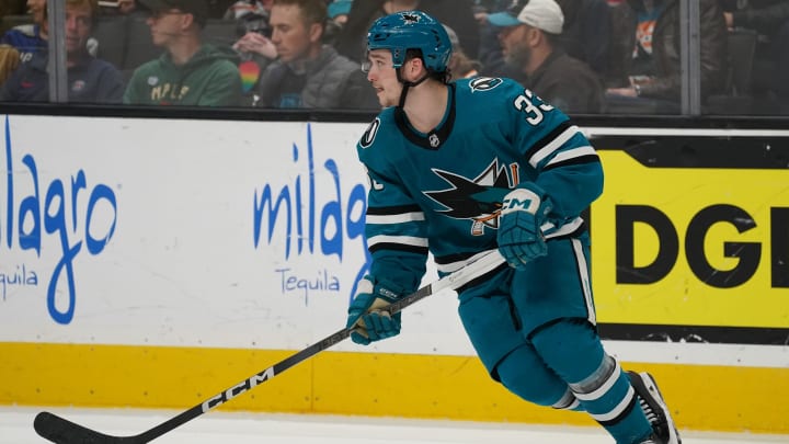 Apr 13, 2024; San Jose, California, USA; San Jose Sharks defenseman Calen Addison (33) controls the puck against the Minnesota Wild during the third period at SAP Center at San Jose. Mandatory Credit: David Gonzales-USA TODAY Sports