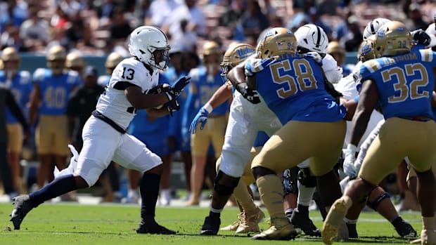 {enn State Nittany Lions running back Kaytron Allen runs for a touchdown during the first quarter against the UCLA Bruins.
