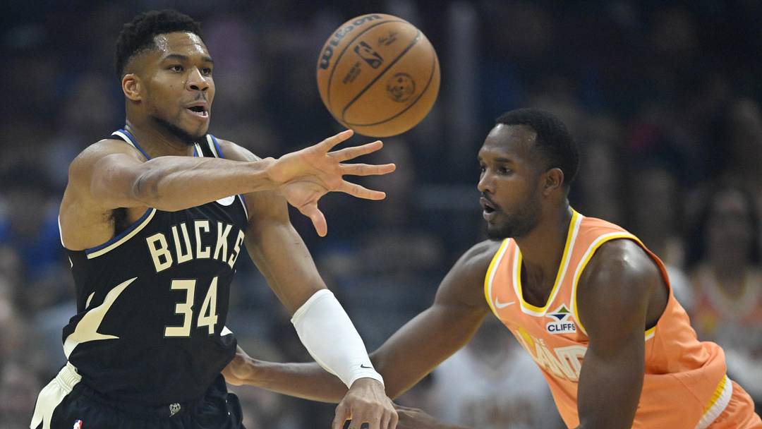 Nov 17, 2025; Cleveland, Ohio, USA; Milwaukee Bucks forward Giannis Antetokounmpo (34) throws a pass beside Cleveland Cavaliers center Evan Mobley (4) in the first quarter at Rocket Arena. Mandatory Credit: David Richard-Imagn Images Nov 17, 2025; Cleveland, Ohio, USA; Milwaukee Bucks forward Giannis Antetokounmpo (34) throws a pass beside Cleveland Cavaliers center Evan Mobley (4) in the first quarter at Rocket Arena. Mandatory Credit: David Richard-Imagn Images