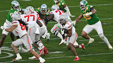 Jan 1, 2025; Pasadena, CA, USA; Ohio State Buckeyes running back Quinshon Judkins (1) carries the ball during the fourth quarter against the Oregon Ducks at Rose Bowl Stadium. Mandatory Credit: Robert Hanashiro-Imagn Images