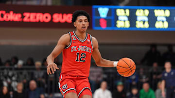Feb 12, 2025; Villanova, Pennsylvania, USA; Saint John's basketball guard RJ Luis Jr (12) controls the ball against the Villanova Wildcats in the second half at William B. Finneran Pavilion.