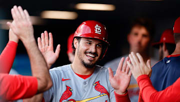Jul 21, 2025; Denver, Colorado, USA; St. Louis Cardinals third baseman Nolan Arenado (28) celebrates in the dugout after scoring on an RBI in the fourth inning against the Colorado Rockies at Coors Field. Mandatory Credit: Isaiah J. Downing-Imagn Images