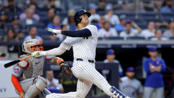 Jul 24, 2024; Bronx, New York, USA; New York Yankees right fielder Juan Soto (22) follows through on a solo home run against the New York Mets during the third inning at Yankee Stadium. Mandatory Credit: Brad Penner-USA TODAY Sports