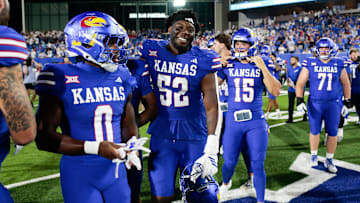 Kansas Jayhawks players celebrate their victor after the game between Fresno State and Kansas at David Booth Kansas Memorial Stadium on Aug. 23, 2025.