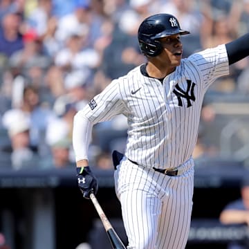 Sep 14, 2024; Bronx, New York, USA; New York Yankees right fielder Juan Soto (22) reacts after hitting a single against the Boston Red Sox during the third inning at Yankee Stadium. Mandatory Credit: Brad Penner-Imagn Images