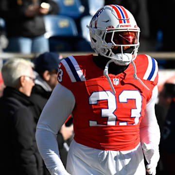 Dec 1, 2024; Foxborough, Massachusetts, USA; New England Patriots linebacker Anfernee Jennings (33) warms up before a game against the Indianapolis Colts at Gillette Stadium. Mandatory Credit: Eric Canha-Imagn Images