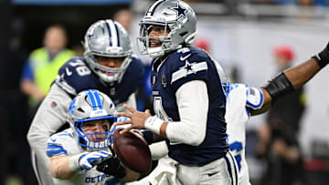 Dallas Cowboys quarterback Dak Prescott is pressured by Detroit Lions DEs Al-Quadin Muhammad and Aidan Hutchinson.