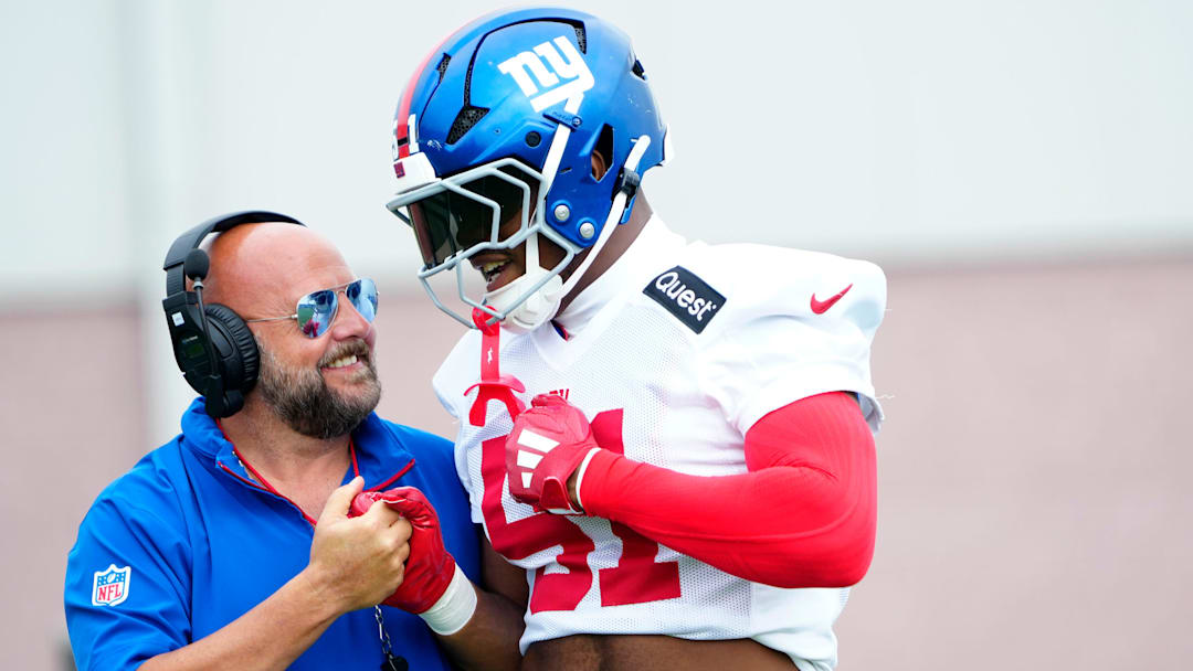 Giants Head Coach, Brian Daboll is shown beside New York Giants linebacker Abdul Carter (51), Sunday, July 27, 2025, in East Rutherford.