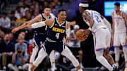 May 11, 2025; Denver, Colorado, USA; Oklahoma City Thunder guard Shai Gilgeous-Alexander (2) controls the ball as Denver Nuggets guard Russell Westbrook (4) guards in the third quarter during game four of the second round of the 2025 NBA Playoffs at Ball Arena. Mandatory Credit: Isaiah J. Downing-Imagn Images
