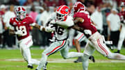 Sep 28, 2024; Tuscaloosa, Alabama, USA;  Georgia Bulldogs wide receiver Dillon Bell (86) runs the ball against Alabama Crimson Tide defensive back Keon Sabb (3) and defensive back Malachi Moore (13) during the fourth quarter at Bryant-Denny Stadium. Mandatory Credit: John David Mercer-Imagn Images