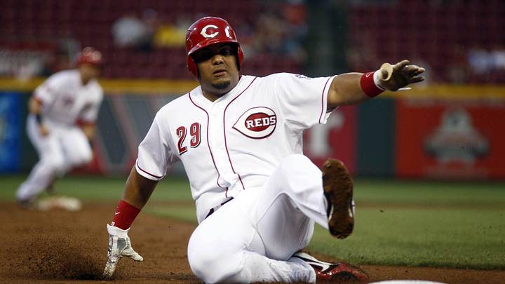 Sep 5, 2015; Cincinnati, OH, USA; Cincinnati Reds catcher Brayan Pena is forced out at third base against the Milwaukee Brewers during the second inning in game two of a doubleheader at Great American Ball Park. Mandatory Credit: David Kohl-Imagn Images
