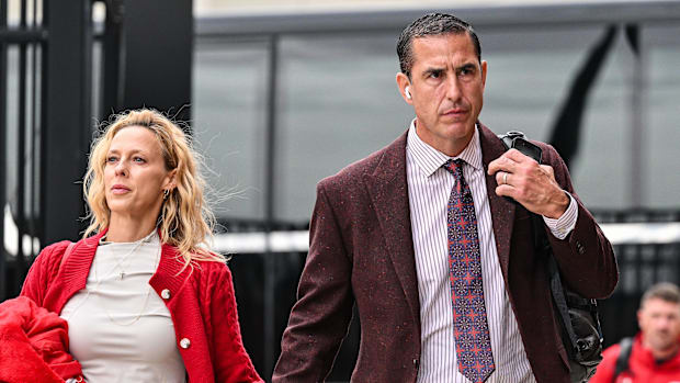 Wisconsin Badgers head coach Luke Fickell and his wife Amy walk into Kinnick Stadium before the game against the Iowa Hawkey