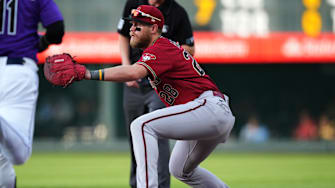 Aug 12, 2022; Denver, Colorado, USA; Arizona Diamondbacks first baseman Seth Beer (28) prepares to field the ball in the first inning against the Colorado Rockies at Coors Field.