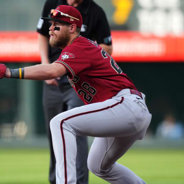 Aug 12, 2022; Denver, Colorado, USA; Arizona Diamondbacks first baseman Seth Beer (28) prepares to field the ball in the first inning against the Colorado Rockies at Coors Field.