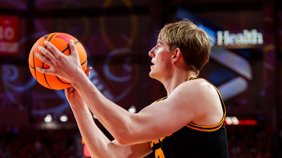 Mar 8, 2026; Lincoln, Nebraska, USA; Iowa Hawkeyes forward Cooper Koch (8) shoots a three-point shot against the Nebraska Cornhuskers during overtime at Pinnacle Bank Arena. Mandatory Credit: Dylan Widger-Imagn Images