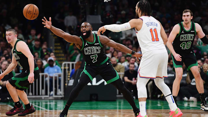 May 14, 2025; Boston, Massachusetts, USA; New York Knicks guard Jalen Brunson (11) passes the ball past Boston Celtics guard Jaylen Brown (7) in the second half during game five of the second round for the 2025 NBA Playoffs at TD Garden. Mandatory Credit: Bob DeChiara-Imagn Images