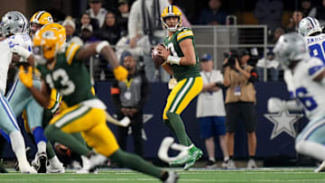 Green Bay Packers quarterback Jordan Love (10) looks for a receiver during the first quarter of the wild card playoff game Sunday, January 14, 2024 at AT&T Stadium in Arlington, Texas. The Green Bay Packers beat the Dallas Cowboys 48-32.