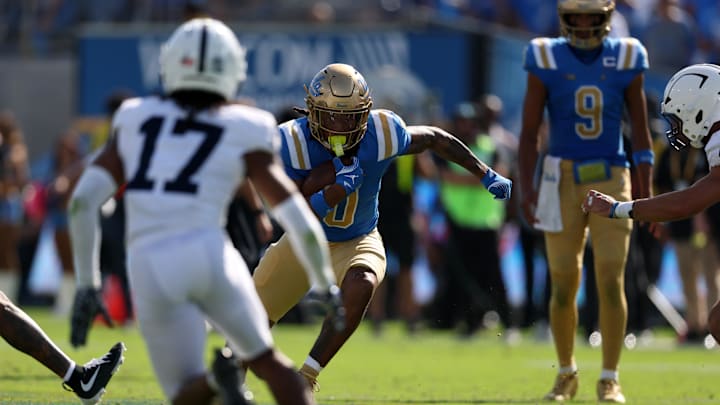 UCLA Bruins running back Jalen Berger (0) runs with the ball  Mandatory Credit: Kiyoshi Mio-Imagn Images