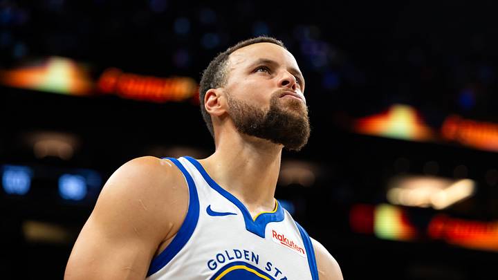 Phoenix, Arizona, USA; Golden State Warriors guard Stephen Curry (30) reacts against the Phoenix Suns during the play-in rounds of the 2026 NBA Playoffs at Mortgage Matchup Center. Mandatory Credit: Mark J. Rebilas-Imagn Images