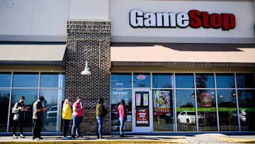 Customers line up to enter GameStop in Turkey Creek on Black Friday, Nov. 27, 2020.