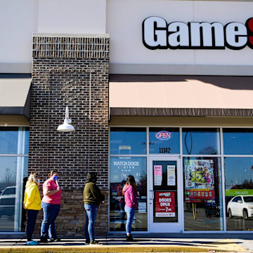 Customers line up to enter GameStop in Turkey Creek on Black Friday, Nov. 27, 2020.