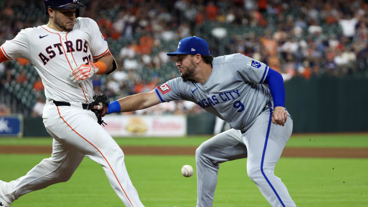 Aug 29, 2024; Houston, Texas, USA;  Houston Astros catcher Yainer Diaz (21) collides with Kansas City Royals first baseman Vinnie Pasquantino (9) in the eighth inning at Minute Maid Park. Mandatory Credit: Thomas Shea-USA TODAY Sports