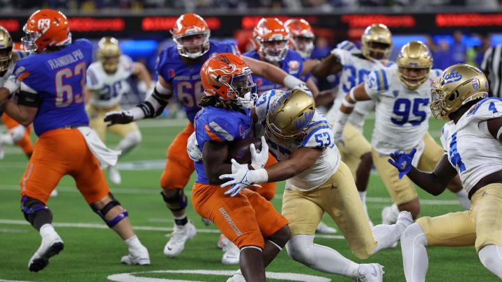 iDec 16, 2023; Inglewood, CA, USA; UCLA Bruins linebacker Darius Muasau (53) tackles Boise State Broncos running back Ashton Jeanty (2) during the third quarter of the LA Bowl at SoFi Stadium. Mandatory Credit: Kiyoshi Mio-USA TODAY Sports