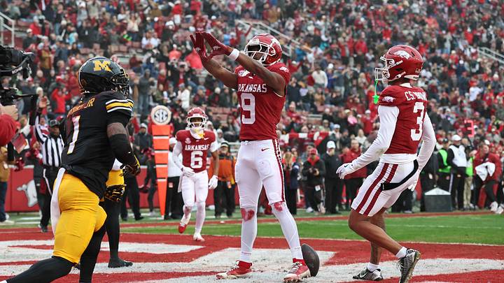 Nov 29, 2025; Fayetteville, Arkansas, USA; Arkansas Razorbacks wide receiver O’Mega Blake (9) celebrates after catching a pass for a touchdown during the first quarter against the Missouri Tigers at Donald W. Reynolds Razorback Stadium. Mandatory Credit: Nelson Chenault-Imagn Images