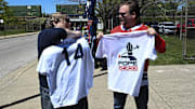 Fans show off Pope Leo XIV jerseys before the game against the Miami Marlins at Rate Field.