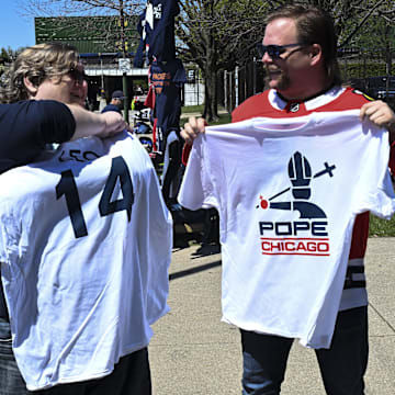 Fans show off Pope Leo XIV jerseys before the game against the Miami Marlins at Rate Field.