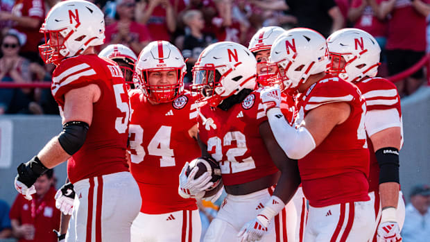 Nebraska Cornhuskers running back Gabe Ervin Jr. (22) celebrates with teammates after scoring a touchdown