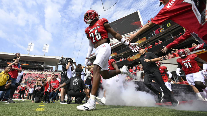 Sep 24, 2022; Louisville, Kentucky, USA; Louisville Cardinals safety M.J. Griffin (26) leads the team to the field before the first quarter against the South Florida Bulls at Cardinal Stadium. 