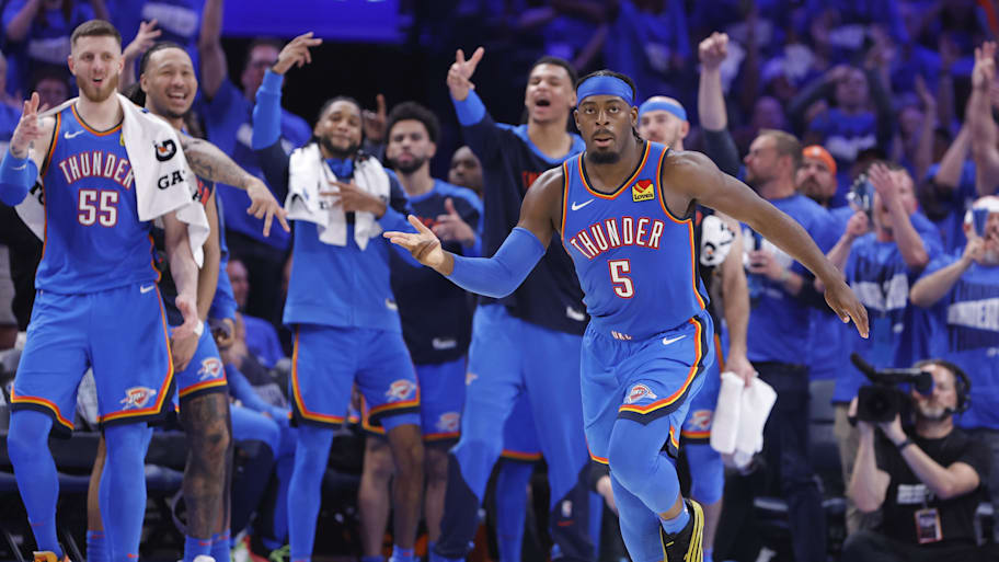 Lu Dort reacts after a basket as the Thunder bench celebrates behind him during the Western Conference finals.