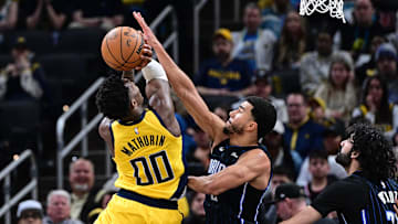 Apr 11, 2025; Indianapolis, Indiana, USA; Indiana Pacers guard Bennedict Mathurin (00) shoots the ball against Orlando Magic guard Caleb Houstan (2) during the second half at Gainbridge Fieldhouse. Mandatory Credit: Marc Lebryk-Imagn Images