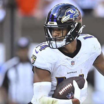 Oct 1, 2023; Cleveland, Ohio, USA; Baltimore Ravens safety Kyle Hamilton (14) runs after intercepting a pass in the fourth quarter against the Cleveland Browns at Cleveland Browns Stadium. Mandatory Credit: David Richard-Imagn Images