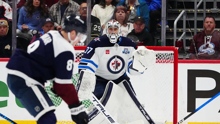 Mar 28, 2026; Denver, Colorado, USA; Winnipeg Jets goaltender Connor Hellebuyck (37) defends his net in the first period against the Colorado Avalanche at Ball Arena. Mandatory Credit: Ron Chenoy-Imagn Images