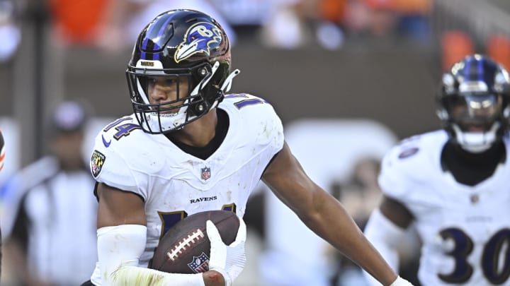 Oct 1, 2023; Cleveland, Ohio, USA; Baltimore Ravens safety Kyle Hamilton (14) runs after intercepting a pass in the fourth quarter against the Cleveland Browns at Cleveland Browns Stadium. Mandatory Credit: David Richard-USA TODAY Sports