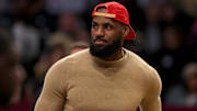 Mar 10, 2025; Brooklyn, New York, USA; Los Angeles Lakers injured forward LeBron James (23) on the court during a time out during the first quarter against the Brooklyn Nets at Barclays Center. Mandatory Credit: Brad Penner-Imagn Images