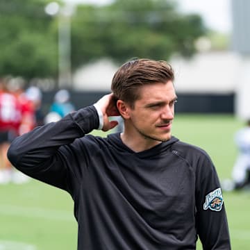 Jacksonville Jaguars general manager James Gladstone, left and Jacksonville Jaguars is executive vice president of football operations Tony Boselli, right, talk on the field after the Jacksonville Jaguars’ mandatory minicamp Tuesday June 10, 2025 at the Miller Electric Center in Jacksonville, Fla. [Doug Engle/Florida Times-Union]