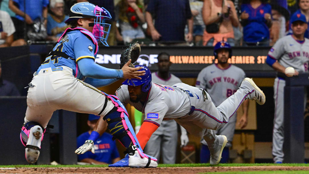 Aug 8, 2025; Milwaukee, Wisconsin, USA;  New York Mets designated hitter Starling Marte (6) tries to score but is tagged out by Milwaukee Brewers catcher William Contreras (24) in the ninth inning at American Family Field. Mandatory Credit: Benny Sieu-Imagn Images