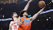 Nov 8, 2024; Oklahoma City, Oklahoma, USA; Oklahoma City Thunder guard Ajay Mitchell (25) shoots in front of Houston Rockets center Alperen Sengun (28) during the second quarter at Paycom Center. Mandatory Credit: Alonzo Adams-Imagn Images