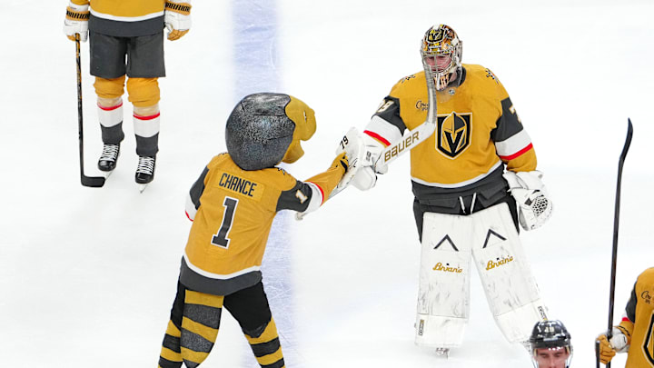 Apr 15, 2026; Las Vegas, Nevada, USA; Vegas Golden Knights goaltender Carter Hart (79) celebrates with Golden Knights mascot Chance after defeating the Seattle Kraken 4-1 at T-Mobile Arena. Mandatory Credit: Stephen R. Sylvanie-Imagn Images