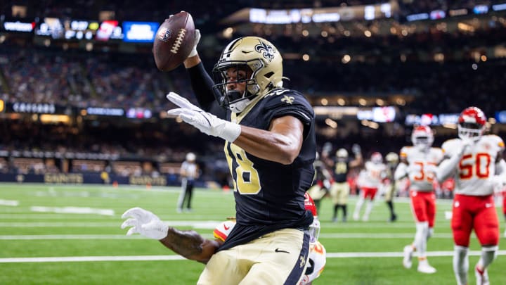Aug 13, 2023; New Orleans, Louisiana, USA; New Orleans Saints wide receiver Keith Kirkwood (18) reacts after making a catch for a touchdown against Kansas City Chiefs safety Justin Reid (20) during the first half at the Caesars Superdome. Mandatory Credit: Stephen Lew-USA TODAY Sports