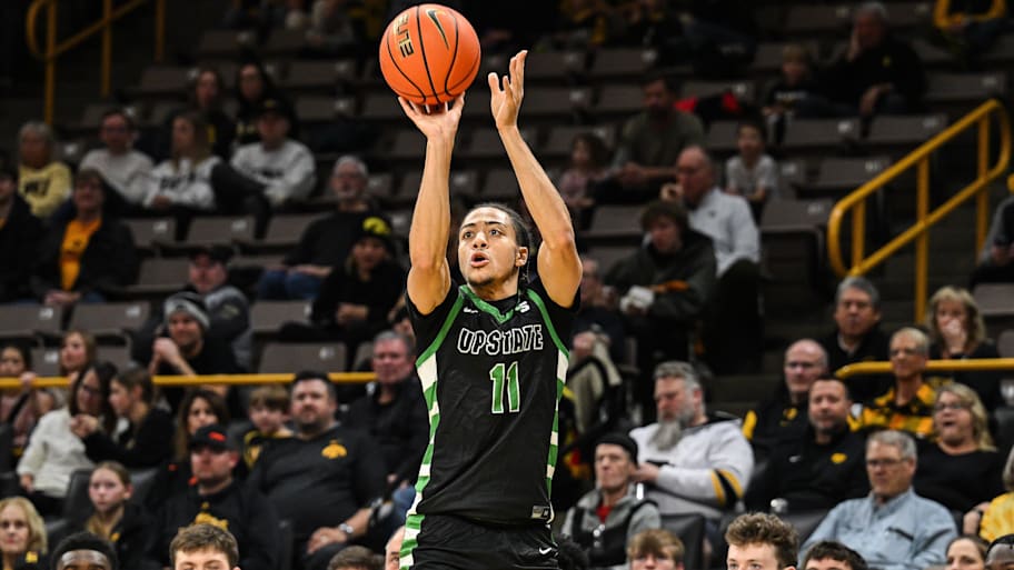 USC Upstate Spartans guard Karmani Gregory shoots the ball against Iowa.