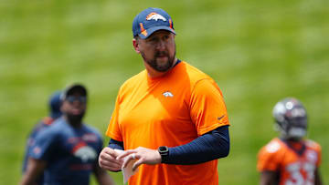 Jun 6, 2022; Englewood, Colorado, USA; Denver Broncos offensive coordinator Justin Outten during OTA workouts at the UC Health Training Center. Mandatory Credit: Ron Chenoy-Imagn Images