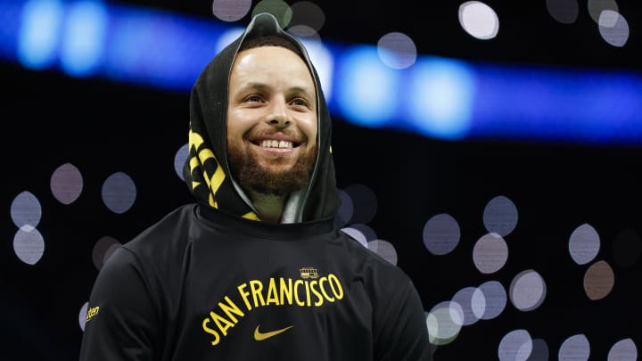 Mar 29, 2024; Charlotte, North Carolina, USA; Golden State Warriors guard Stephen Curry (30) smiles as he looks into the crowd during a timeout as the Warriors plays against the Charlotte Hornets during the second half at Spectrum Center. Mandatory Credit: Nell Redmond-USA TODAY Sports