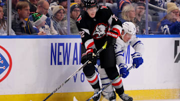 Dec 20, 2024; Buffalo, New York, USA;  Buffalo Sabres center Tage Thompson (72) controls the puck as Toronto Maple Leafs right wing Mitch Marner (16) defends during the third period at KeyBank Center. Mandatory Credit: Timothy T. Ludwig-Imagn Images