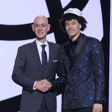 Jun 25, 2025; Brooklyn, NY, USA;  Nolan Traore stands with NBA commissioner Adam Silver after being selected as the 19th pick by the Brooklyn Nets in the first round of the 2025 NBA Draft at Barclays Center. Mandatory Credit: Brad Penner-Imagn Images